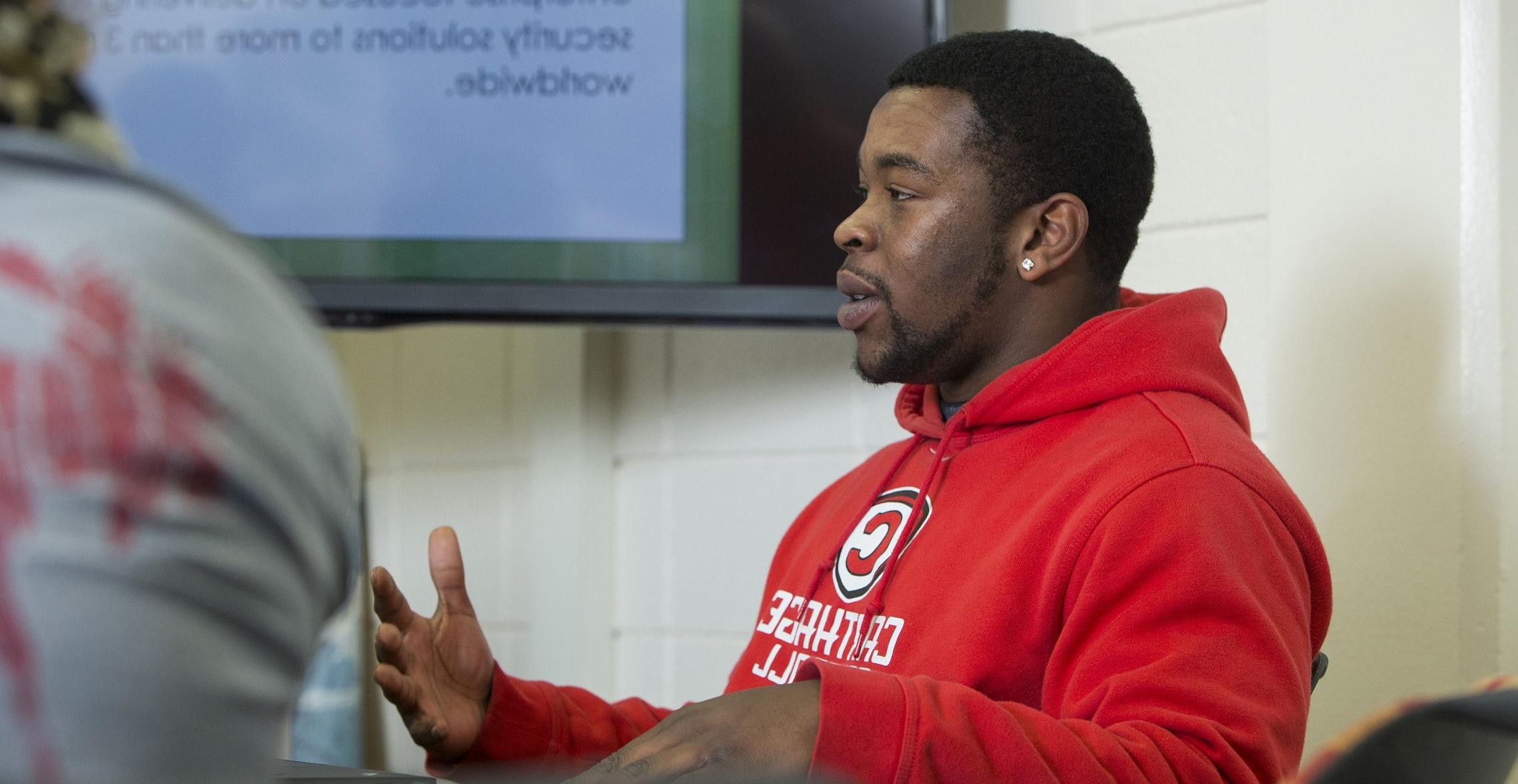 A communication major leads a discussion during a communication class.